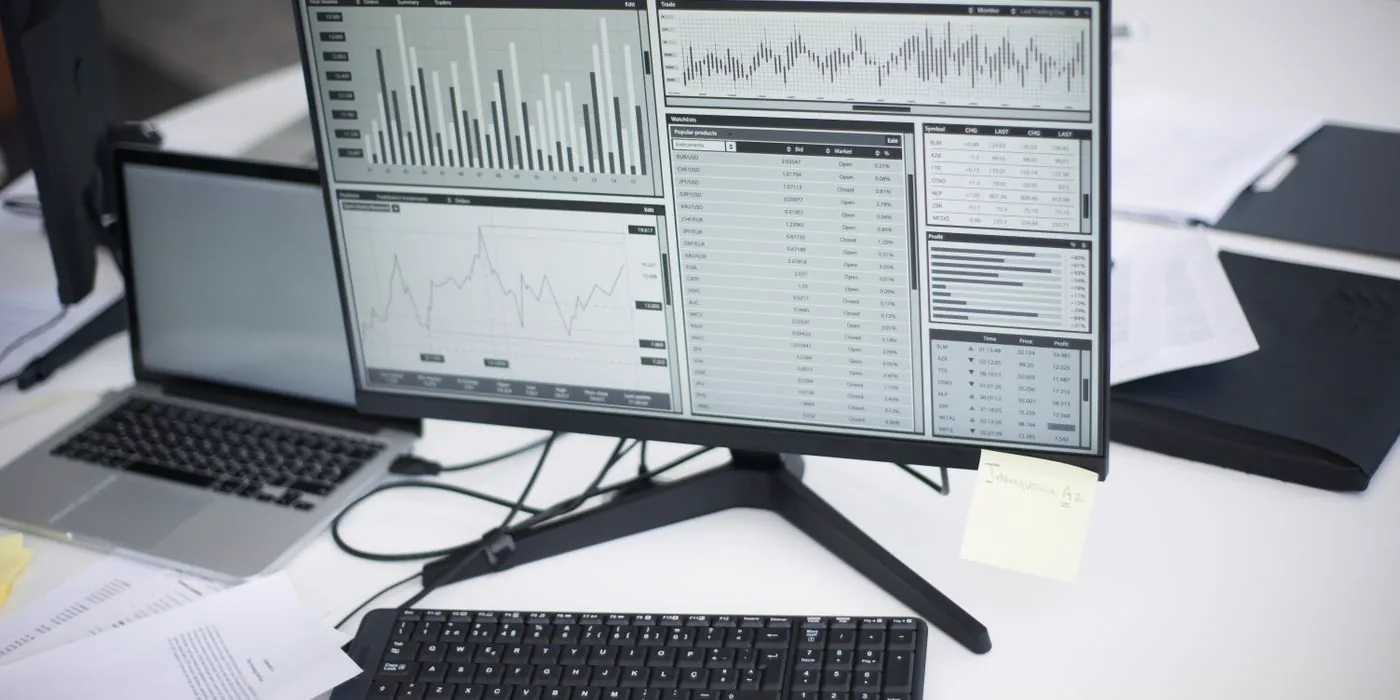 A desktop monitor displaying analytics charts and reporting data